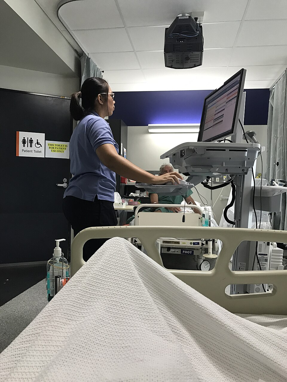 A nurse using a mobile clinical workstation at Princess Alexandra Hospital, Brisbane